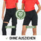 Dame in einer Merino Zip Off Hose in der Farbe schwarz mit orangem T-Shirt.