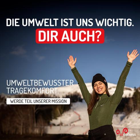 Umweltbewusste Frau trägt Merino-Oberteil in der Farbe Grün
