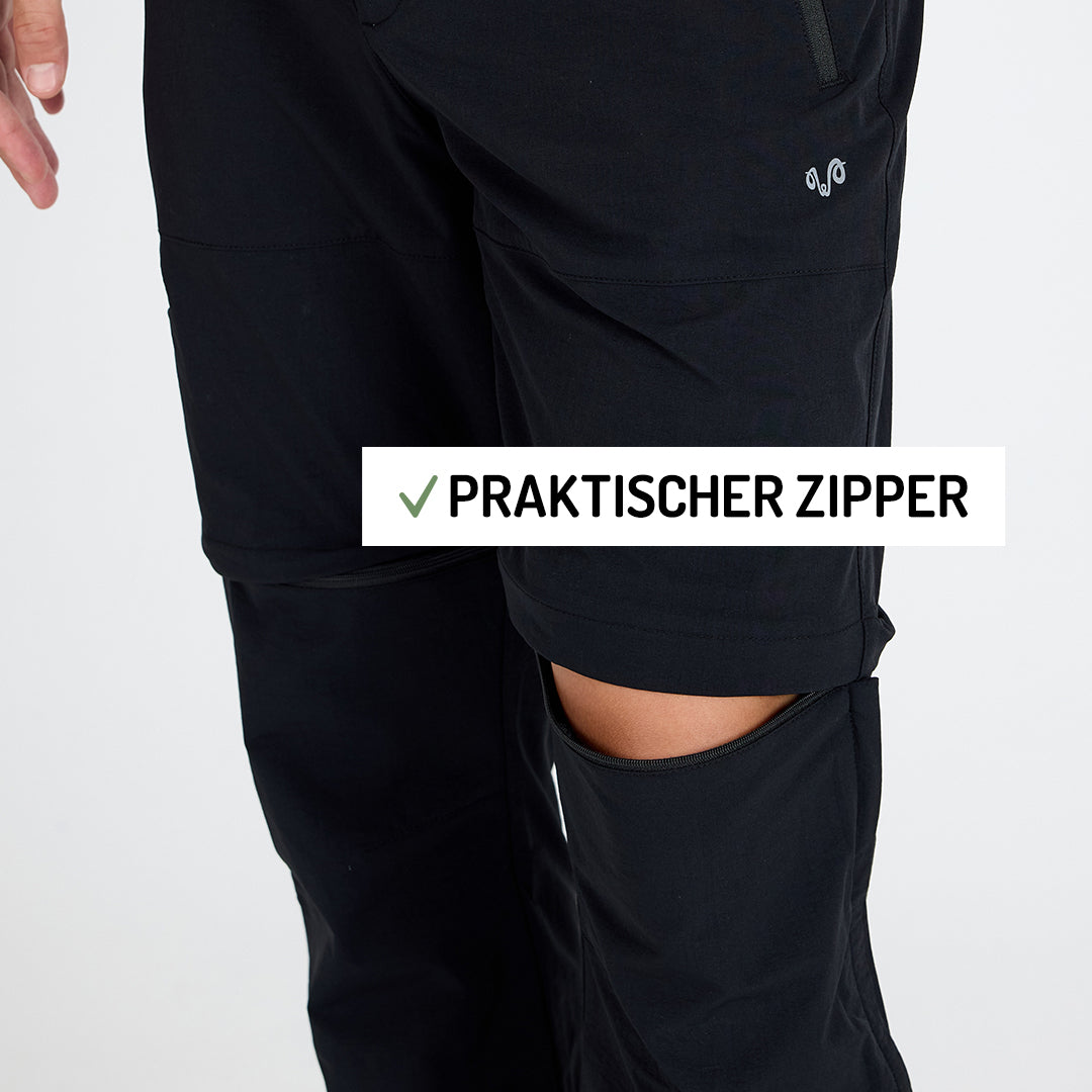 Ansicht einer Merino Zip-Off Outdoorhose in der Farbe schwarz. Der Zipper ist offen. 